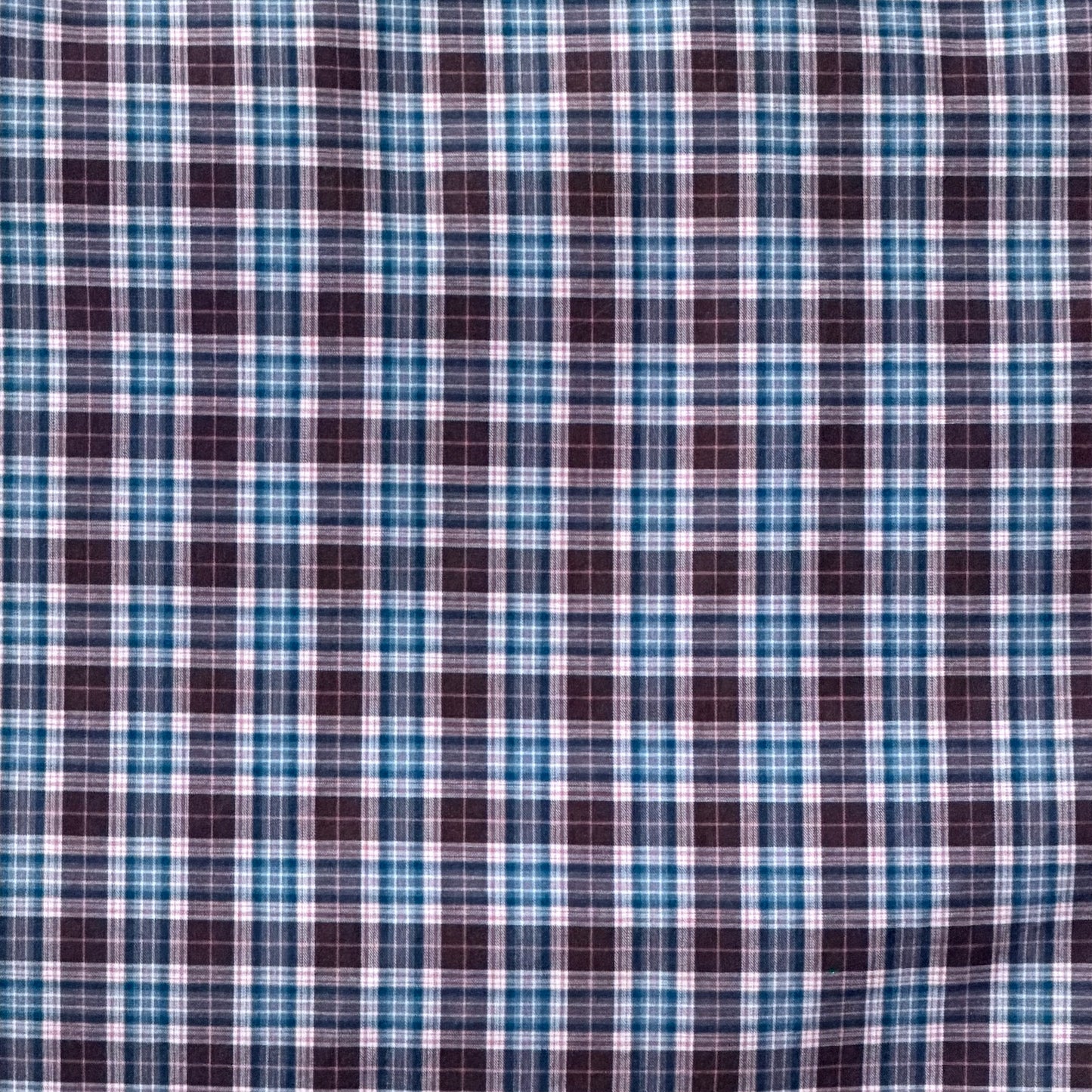 Close-up of blue and brown plaid fabric